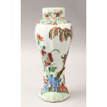 A 18TH / 19TH CENTURY CHINESE FAMILLE ROSE RIBBED VASE, decorated with scenes of floral display,