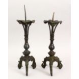 A GOOD PAIR OF CHINESE MING BRONZE PRICKET STICKS, stoof upon three mythical beast feet, with a