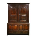 A GOOD 18TH CENTURY OAK CUPBOARD, the top with double panel doors enclosing hanging space, over a