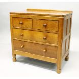 A ROBERT THOMPSON OF KILBURN "MOUSEMAN" OAK CHEST, of two short and two long drawers, with turned