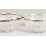 A PAIR OF SILVER MOUNTED CUT GLASS BOWLS. 4.25ins diameter. Birmingham 1945.