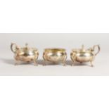 A GARRARD & CO CONDIMENT SET, comprising pair of mustard pots & covers and a salt with gadrooned