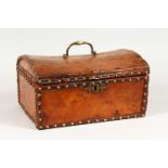 AN 18TH/19TH CENTURY LEATHER AND BRASS STUDDED DOME TOP CASKET. 11.5ins wide.