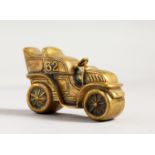 A NOVELTY BRASS VINTAGE CAR MODEL.