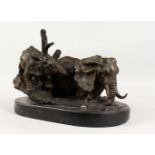 A GOOD BRONZE OF TWO ELEPHANTS, on a marble base. 16ins long.