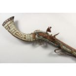 AN AFGHAN FLINTLOCK LONG GUN, octagonal barrel, full stock with mother-of-pearl inlay, lock from