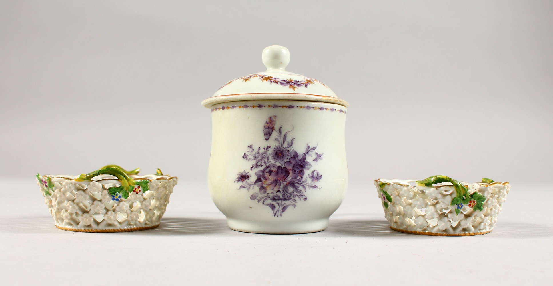 A CUP AND COVER, wit pink decoration and A TINY PAIR OF MEISSEN LATTICE BASKETS, 2.5ins.