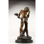 A CLASSICAL BRONZE OF A YOUNG BOY "THINKING", carrying a branch with two birds, on a circular marble
