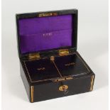 A SMALL GILT TODDLERS LEATHER JEWELLERY BOX, labelled to the interior Gold & Silver. 6ins wide.