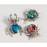 THREE GEM SET SILVER BUG BROOCHES.