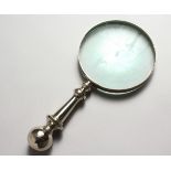 A MAGNIFYING GLASS, with plate handle.