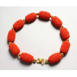 A SET OF NINE LARGE CORAL BEADS NECKLACE.