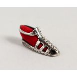 A TINY NOVELTY SILVER SHOE PIN CUSHION.