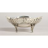 A PIERCED OVAL BONBON DISH, on four curving legs. London 1916.