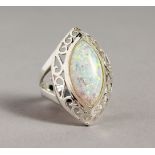A SILVER AND GILSON OPAL RING.