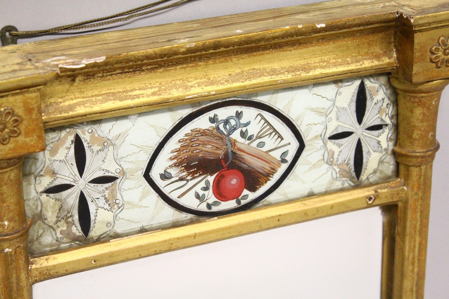 A SMALL REGENCY GILT FRAMED PIER MIRROR, with reverse painted frieze. 22.25ins high x 12.75ins - Image 2 of 5