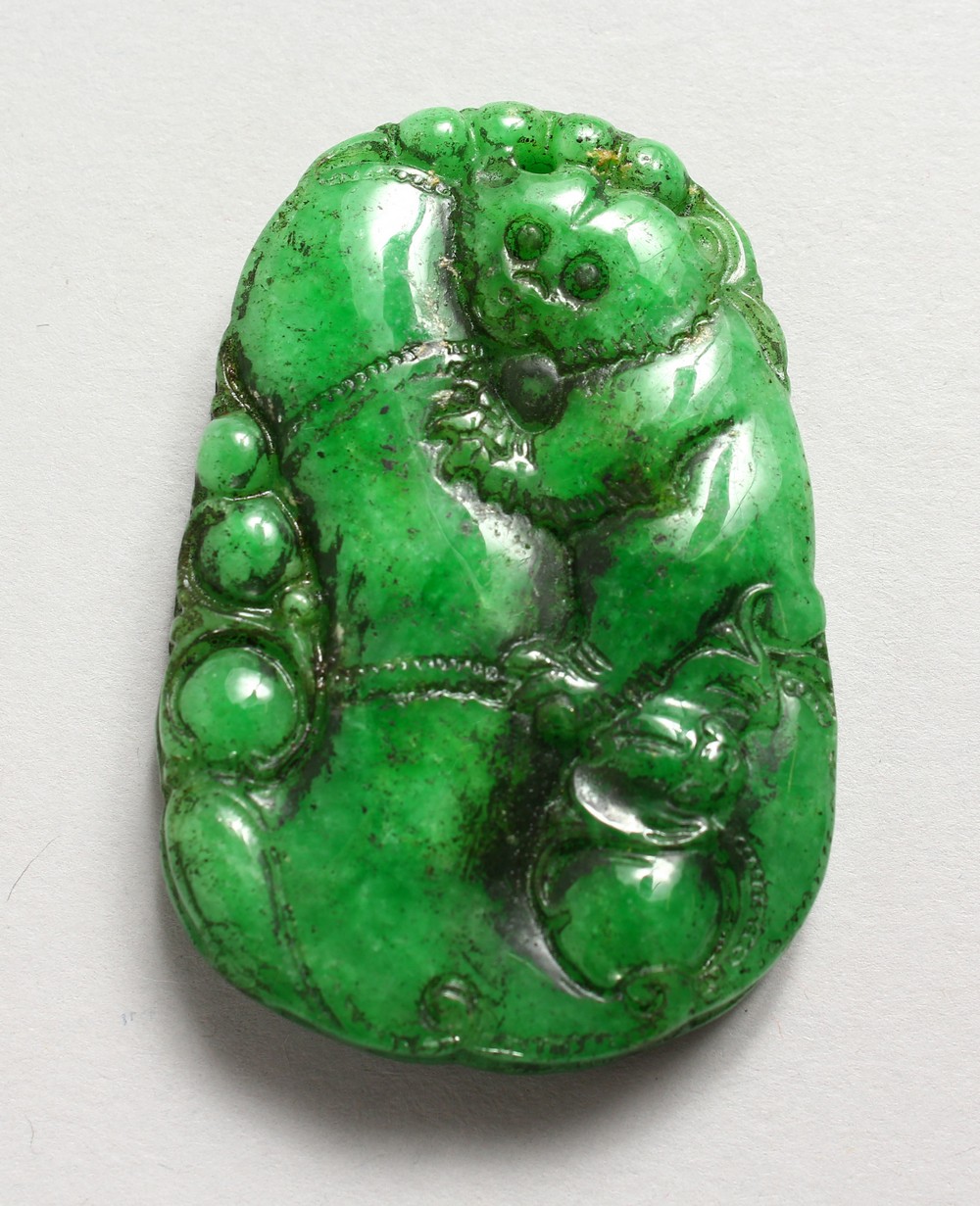 A CARVED JADE PENDANT.