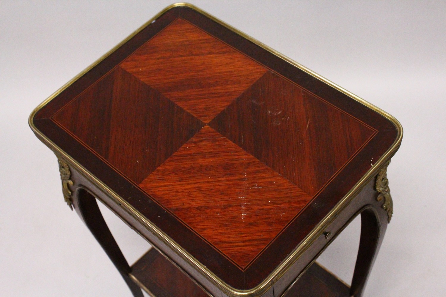 A SMALL LATE 19TH CENTURY FRENCH MAHOGANY AND ORMOLU TABLE, with a drawer to one end, on slender - Image 2 of 3