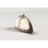 A NOVELTY SILVER JOCKEY CAP VESTA CASE.