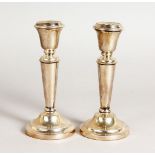 A PAIR OF SILVER CANDLESTICKS, on circular bases. 5.25ins high. Birmingham.