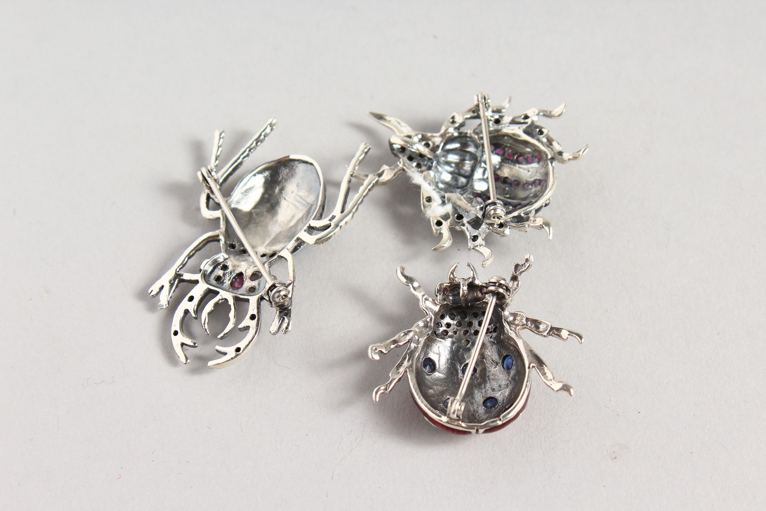 THREE GEM SET SILVER BUG BROOCHES. - Image 2 of 2