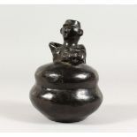 A SOUTH AMERICAN POTTERY "BLACK WARE" FIGURAL VESSEL. 6.5ins high.