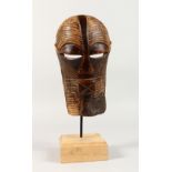 A SONGYE TRIBAL MASK, on later stand. Mask: 10ins high.
