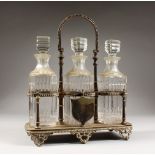 A GOOD THREE BOTTLE CUT GLASS TANTALUS, with three whisky decanters & stoppers and shield plaque.