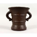 A LATE 17TH/EARLY 18TH CENTURY CAST IRON TWIN-HANDLED MORTAR. 5.5ins high.