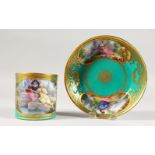 A GOOD SEVRES CUP AND SAUCER, the cup painted with a man playing a pipe, the saucer two vignettes.