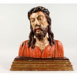 A 16TH/17TH CENTURY CARVED WOOD AND POLYCHROME PAINTED BUST OF CHRIST, on a gilded, stepped wooden