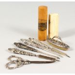A GROUP OF SEWING IMPLEMENTS.