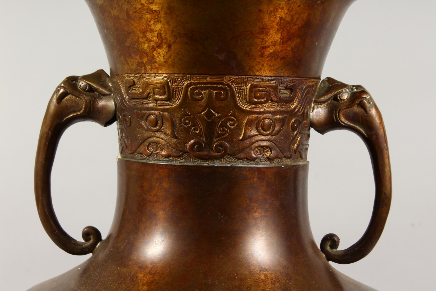 A LARGE CHINESE BRONZE ARCHAIC TWO-HANDLED LAMP, on a circular base. 19ins high. - Image 2 of 5