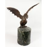 A GOOD LARGE BRONZE OF A DRAGON, with outstretched wings. 2ft 8ins long. Note: Base not included.