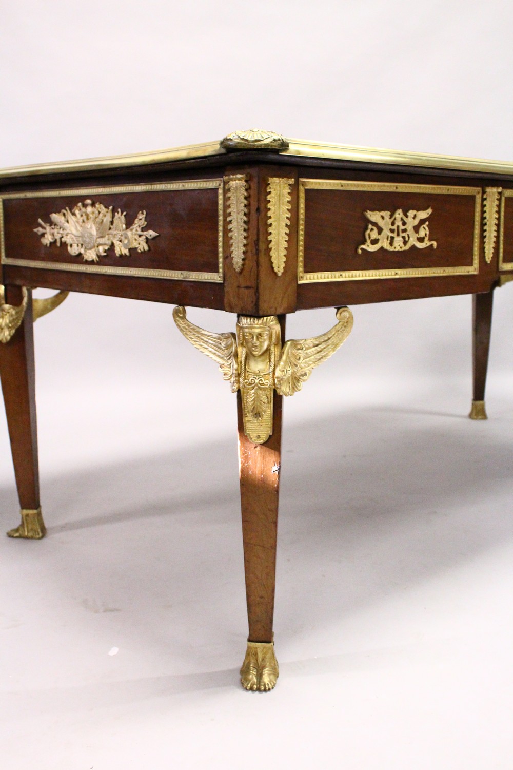 A FRENCH EMPIRE REVIVAL MAHOGANY AND ORMOLU BUREAU PLAT, the leather inset writing surface above a - Image 3 of 6