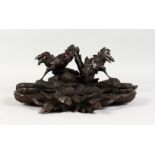 A VERY GOOD 19TH CENTURY BLACK FOREST CARVED WOOD INKSTAND with two birds. 13ins wide.