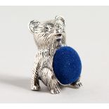 A NOVELTY SILVER TEDDY BEAR PIN CUSHION.