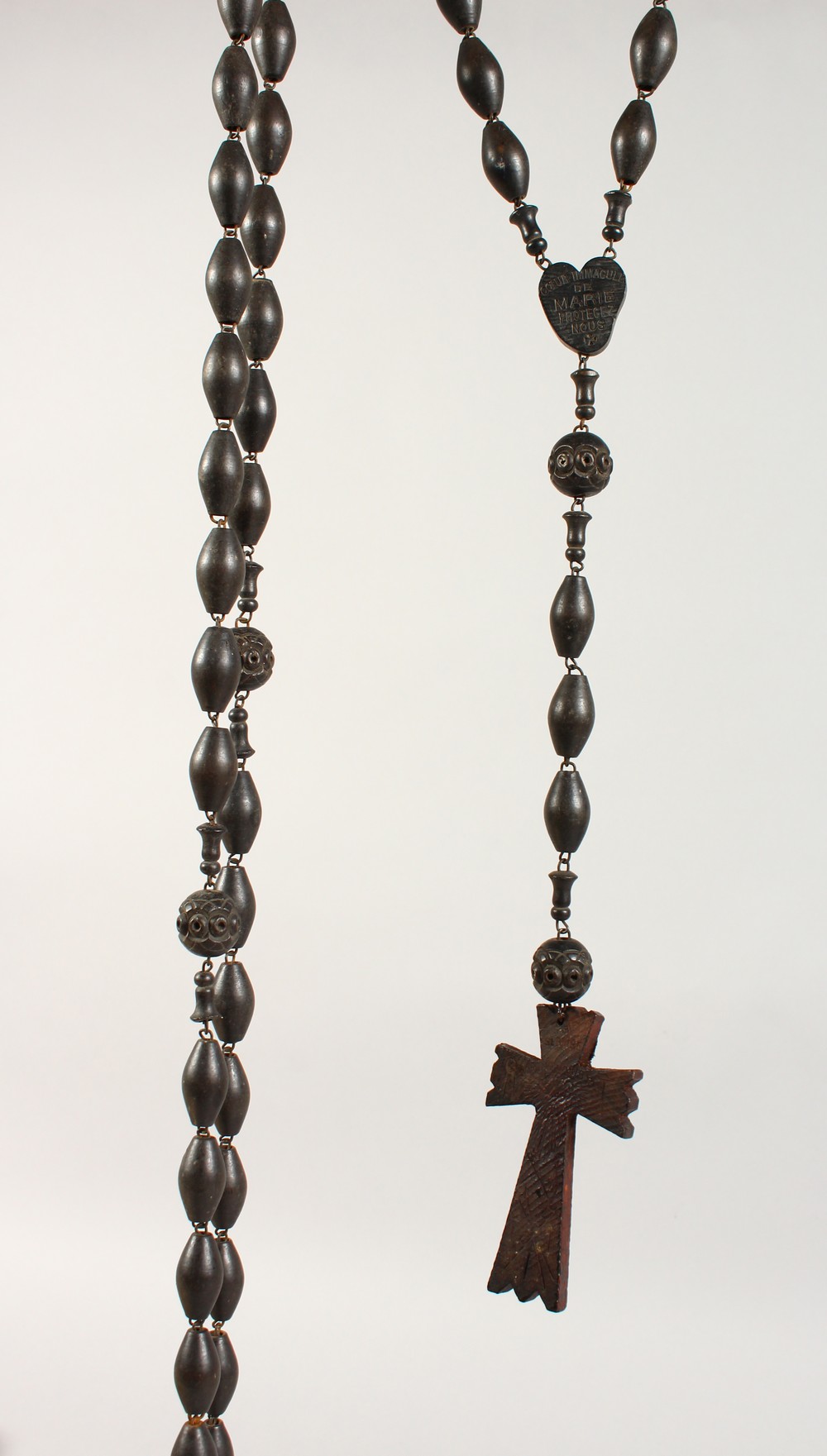 A ROSARY NECKLACE.