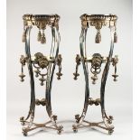 A GOOD PAIR OF SILVER PLATED GUERIDONS, with ornate hanging tassels, lion mask mounts, on four