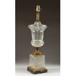 A LARGE CUT GLASS AND ORMOLU URN SHAPED LAMP. 2ft 3ins high.