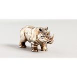 A NOVELTY SILVER RHINO.