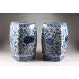 A LARGE PAIR OF CHINESE PORCELAIN BLUE AND WHITE BARREL SEATS. 19ins high.