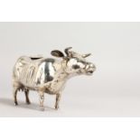 A GOOD EARLY DUTCH SILVER COW CREAMER, 8ins long, with a bee cover.