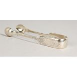 A PAIR OF SILVER ENGRAVED SUGAR TONGS. London 1883.