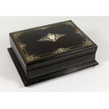 A GOOD LATE 19TH CENTURY EBONISED AND IVORY INLAID GAMES BOX, the hinged lid opening to reveal a