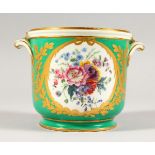A SEVRES APPLE GREEN CIRCULAR JARDINIERE, edged in gilt and painted with reverse panels of