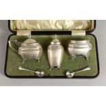 A CASED THREE PIECE CRUET. Sheffield 1910.