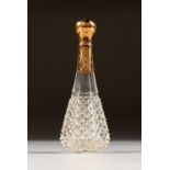 AN 18CT GOLD MOUNTED CUT GLASS SCENT BOTTLE.