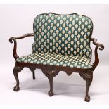 A GEORGE III DESIGN MAHOGANY SMALL SETTEE, with upholstered back and drop-in seat, curving arms with