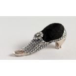 A VICTORIAN STYLE SILVER SHOE PIN CUSHION.